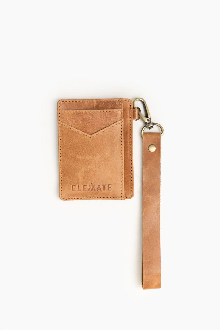 Vi·a: traveling through (a place) en route to a destination. A petite powerhouse, our handcrafted Via Wristlet Wallet is perfect for carrying the essentials. Thoughtfully designed to hold all your cards + cash, and is conveniently smaller than other wallets to boot. Designed with a detachable wristlet so you can clip this beauty to your favorite handbags & totes for easier access! Ethically made and sustainably sourced, this piece is a no-brainer for those needing an on-the-go card carrying acce Brown Wristlet With Cell Phone Pocket For Everyday, Everyday Brown Wristlet With Cell Phone Pocket, Card Holder With Card Slots For Daily Use, Brown Everyday Wristlet With Cell Phone Pocket, Rectangular Wristlet With Interior Card Slots For Everyday Use, Rectangular Wristlet With Card Slots For Everyday Use, Brown Wristlet With Card Slots For Daily Use, Rectangular Leather Travel Wristlet, Versatile Leather Wristlet For Travel