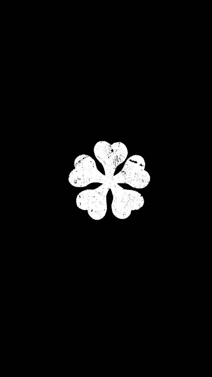 a black and white photo of a four leaf clover