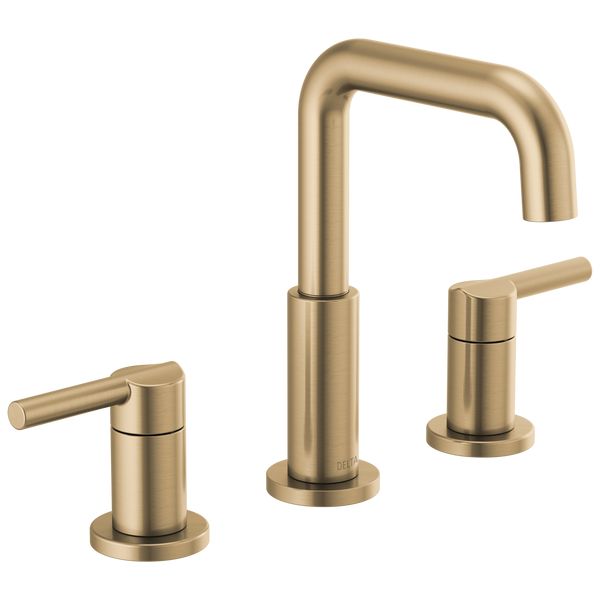 two faucets in brushed brass finish