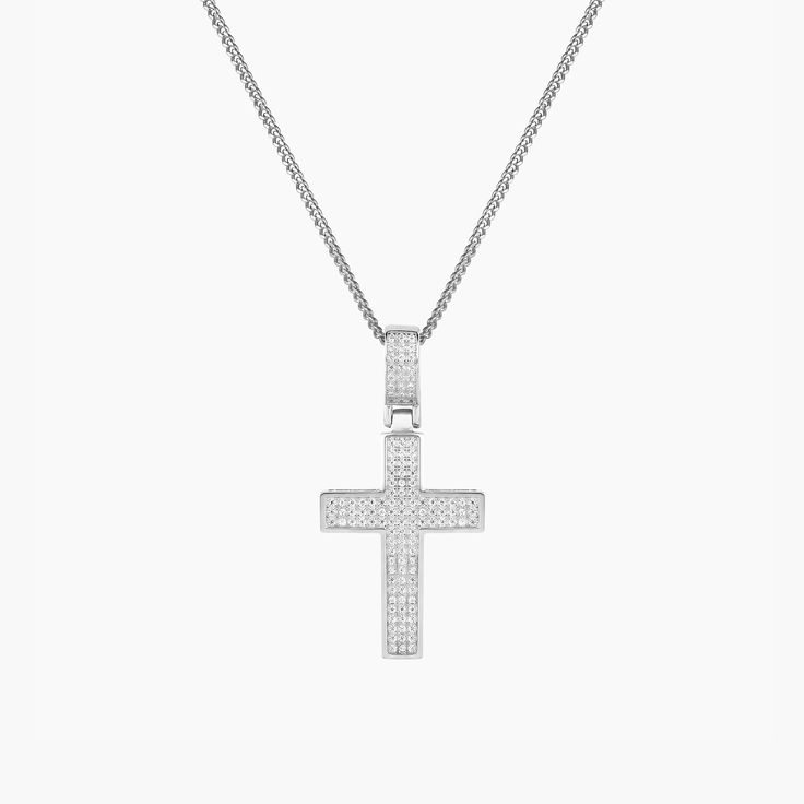 Product Details Chain Type: Mini Cuban Chain Chain Length: 16" + 2" Inch Extension Closure: Lobster Clasp Stone: Cubic Zirconia Metal Selection: Sterling Silver 14k Gold over Silver Description Celebrate your faith with the Zirconia Enriched Cross Pendant Necklace in a high-polish finish. Features a moving cross charm decked with mini cubic zirconia gems and a matching gem-adorned pendant bail. Available in premium sterling silver and 14K gold plating, the piece measures 16’’ and comes with a cl Pretty Cross, Pendant Bail, Rings And Bracelets, Pendant Bails, Photo Pendant, Figaro Chain, Personalized Rings, Engraved Jewelry, Cross Charms