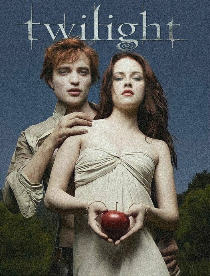 the twilight saga movie poster with two people holding an apple