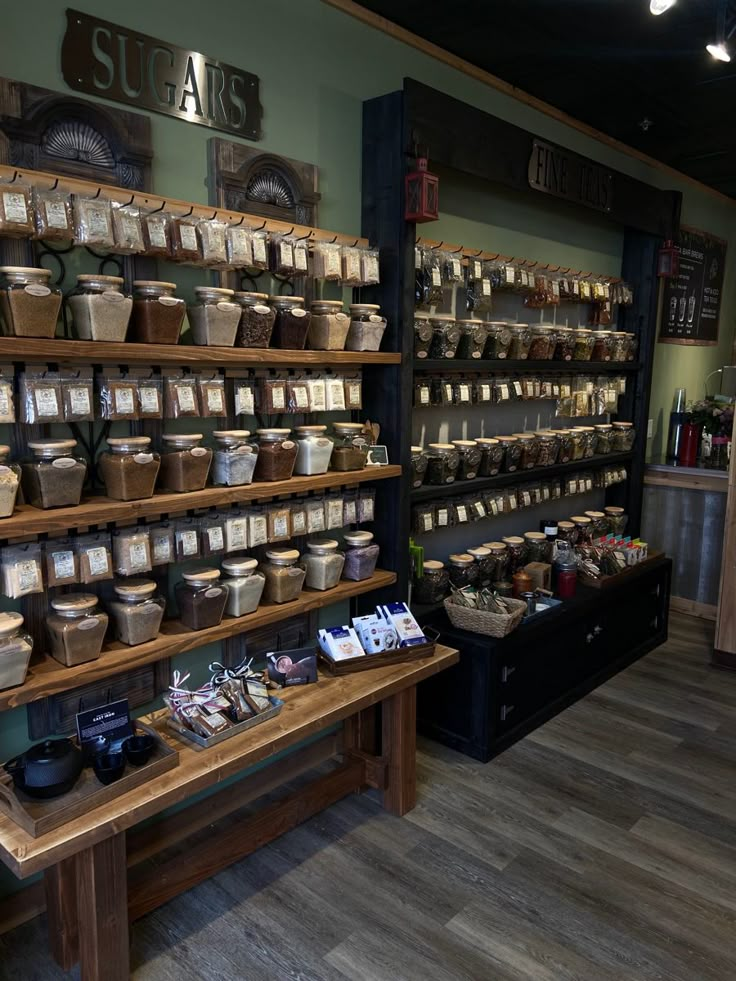 there are many items on the shelves in this store that is filled with teas