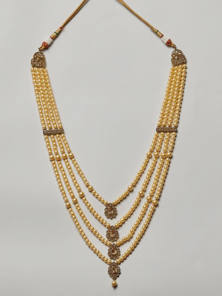 Men's maharaja pearl necklace with stone work Traditional Indian Jewelry: Slight Color variations possible due to difference in screen and photograph. If you are interested in purchasing this item and have any questions about this item, please feel free to send us a message. Care instructions Keep Jewelry away from direct heat, water, perfumes, deodorants and other strong chemicals as they may react with the metal or plating. Perspiration (sweat) will not damage the jewelry. Wipe Jewelry gently Festive Bollywood Pearl Chain Necklace, Bollywood Style Beaded Jewelry For Rituals, Temple Jewelry Pearl Chandbali Necklaces, Pearl Chandbali Necklaces For Festivals, Bollywood Kundan Necklace With Pearl Pendant, Temple Style Pearl Chain Necklaces For Festive Occasions, Bollywood Style Kundan Necklace With Pearl Pendant, Bollywood Style Pearl Chain Necklaces For Festivals, Traditional Pearl Chain Necklace For Ceremonies