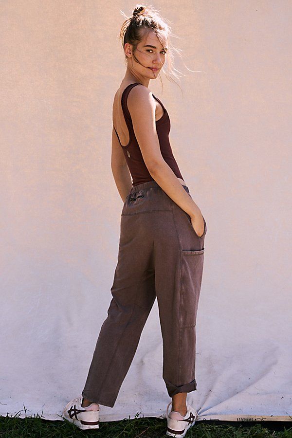 The perfect pants for laidback days, light activity and lounging, these slouchy sweats from our Hot Shot Collection feature a wide, high-rise waistband and a cool dropped crotch design with bold cargo pockets. * Ultra-comfy feel * Pull-on style * Can be worn high or low on the hips | Hot Shot Pants by FP Movement at Free People, Charcoal Brown, S Baggy Utility Bottoms For Loungewear, High Rise Relaxed Fit Parachute Pants, High Waist Parachute Pants With Relaxed Fit For Loungewear, Casual High Rise Parachute Pants With Relaxed Fit, Trendy Cargo Style Sweatpants For Loungewear, Everyday Sporty Cargo Bottoms, Sporty Everyday Cargo Bottoms, Sporty Everyday Cargo Style Bottoms, High Rise Relaxed Fit Loungewear Bottoms