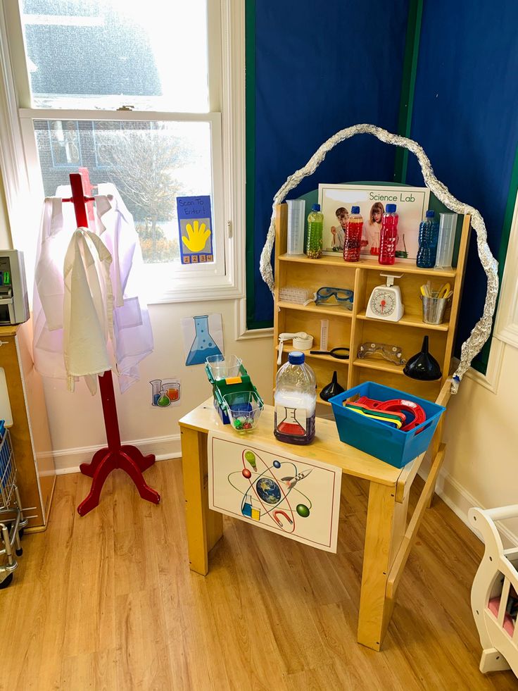 a child's play room with toys and books