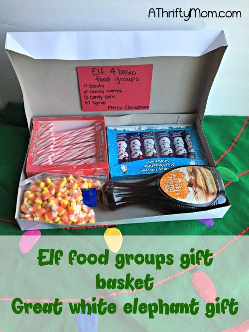 an open box filled with candy and candies on top of a green table cloth