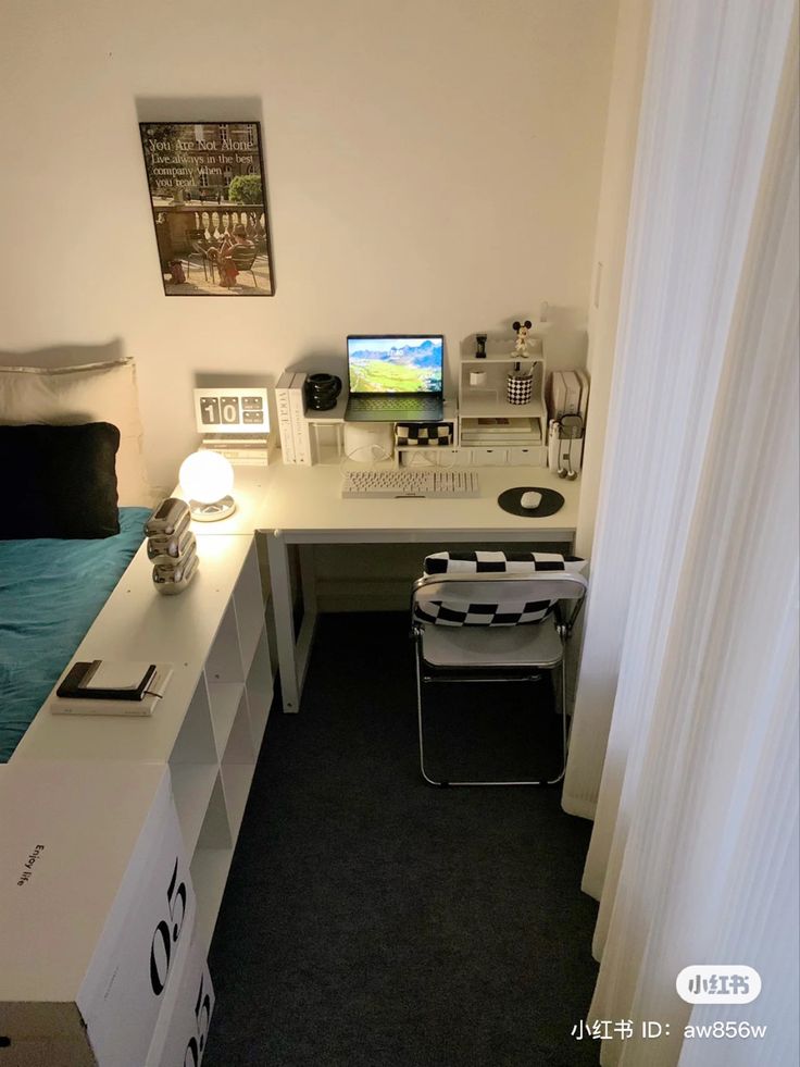 a white desk with a computer on top of it