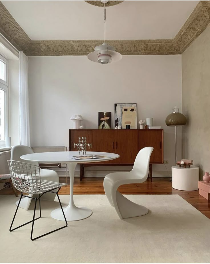 a white table and chairs in a room