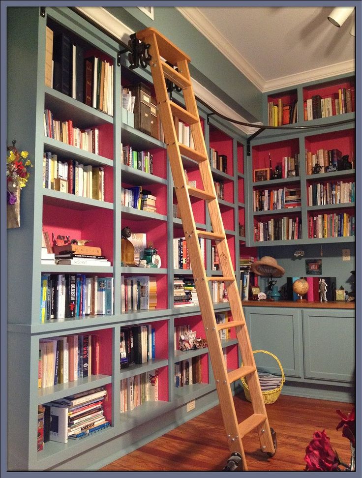 a ladder leaning up against a bookshelf filled with books