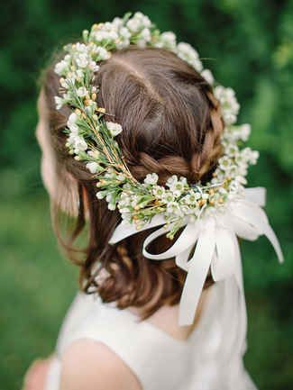 Crowned with green and white buds plus a silk bow will have your flower girl feeling like the belle of the ball. A simple braided halo lends a romantic vibe to her hairstyle. Flower Girl Hair Wreath, Girls Crown, Hair Wreaths, Hair Wreath, Flower Girl Hairstyles, Martha Stewart Weddings, Wedding Flower Girl, Wedding Hairstyles Updo, Girl Short Hair