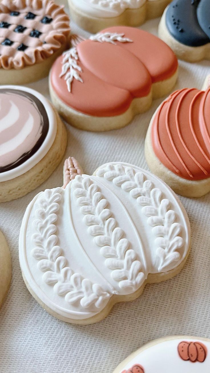 some decorated cookies are sitting on a table