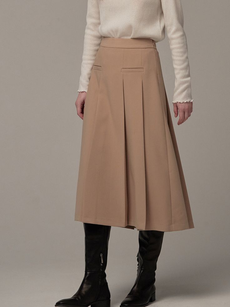 Editor's Notes This is a semi A-line skirt with wide pleats.It's a modern skirt that can be styled casually or femininely, making it a great item for daily wear.- With pleats that have been meticulously handcrafted during production- Made of a polyester-rayon blend material that naturally falls into a semi A-line shape- A welt pocket detail on the front panel to enhance the finish of the skirt* Please note that the color of the product in the photo may be closer to the actual product than the color in the model's photo.* There may be a color difference with the actual product color due to the monitor's resolution.Measurements(in.)Size(34/36)- Length: 30.71 in. / 30.71 in.- Waist: 13.58 in. / 14.57 in.- Hip: 18.31 in. / 19.29 in.- Bottom Width: 29.53 in. / 30.51 in.* Model Info(TASI): Chic A-line Maxi Skirt For Work, Beige A-line Pleated Skirt For Fall, Beige A-line Pleated Skirt For Work, Classic A-line Pleated Skirt For Fall, Fall A-line Pleated Maxi Skirt, Voluminous A-line Skirt With Pleated Hem, Classic Beige A-line Skirt, Long Pleated Skirt For Office, Relaxed A-line Office Skirt