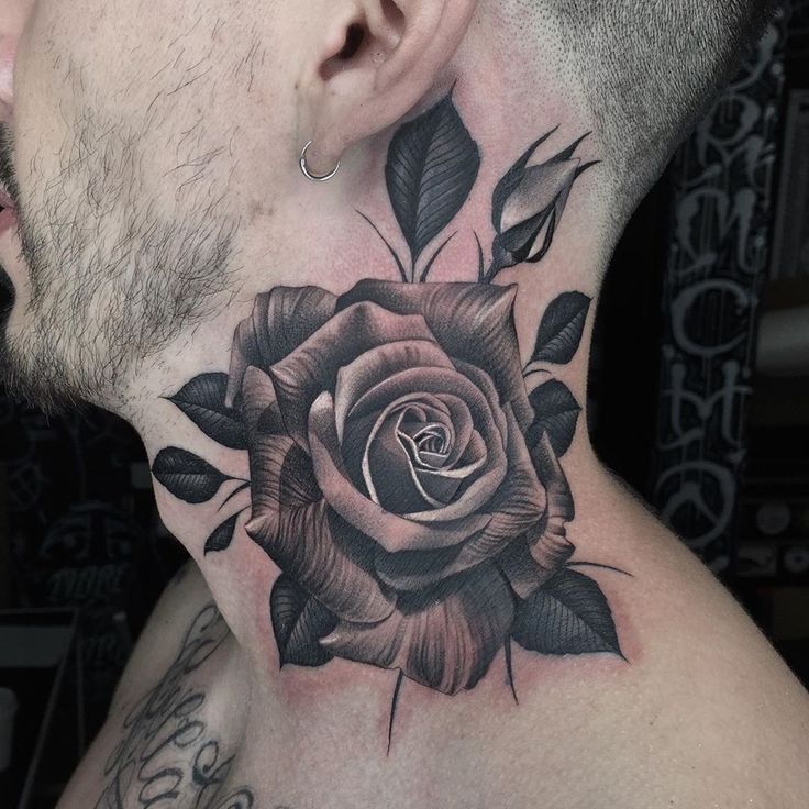 a man with a rose tattoo on his neck