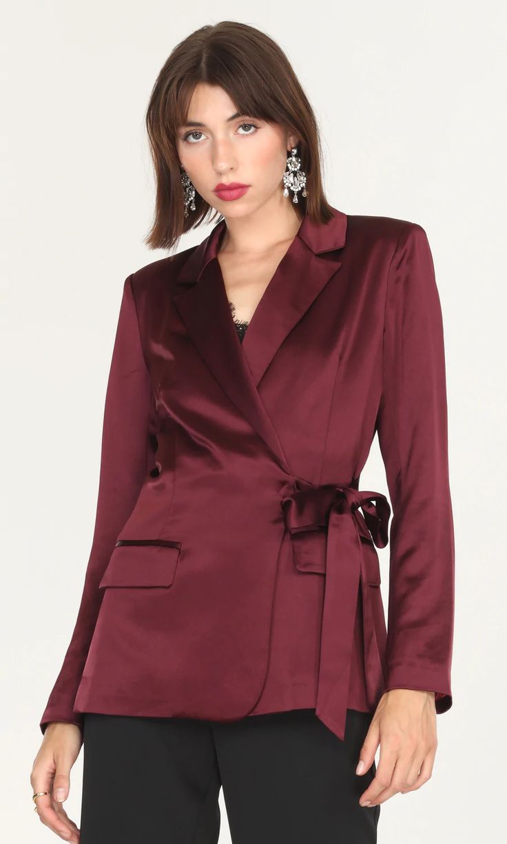 For minimal effort with maximum elegance, the Glenda Satin Side Tie Blazer is soon to become your new favorite. With subtle shoulder pads to help you feel put together and polished and a belt that can be tied or worn loosely, how you wear it is entirely up to you. Satin blazer   Side tie  Welt pockets  Tailored Light s Tie Blazer, Belly Shirts, Burgundy Blazer, Blazer Outfits For Women, Silk Blazer, Satin Blazer, Luxury Women Fashion, Blazer Outfits, Work Attire