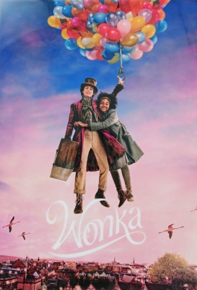 two people are flying in the air with balloons above them, and there is an advertisement for monka