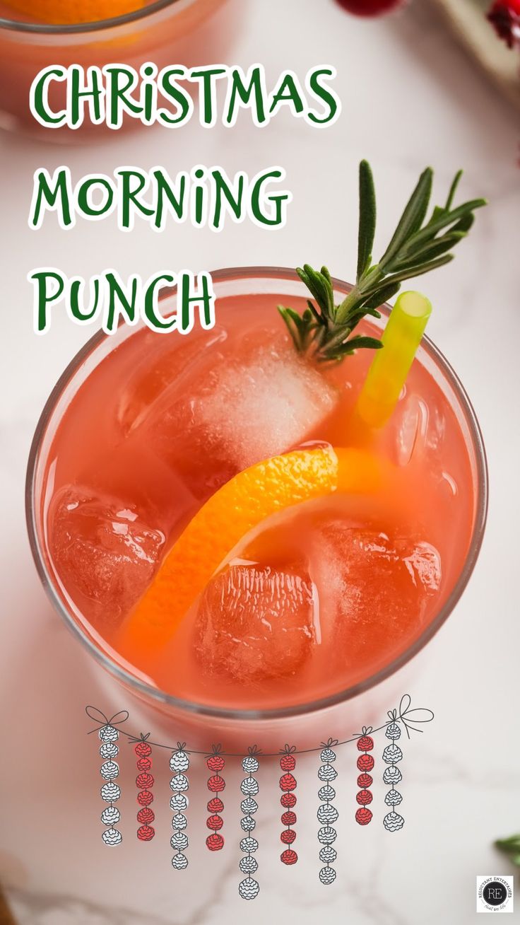 a christmas morning punch with an orange garnish