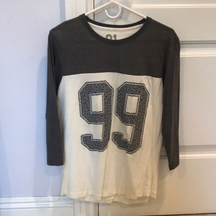 Purchased Years Ago And Never Worn. Unfortunately The White Has Yellowed A Bit Due To Being In A Closet For So Long (Hard To Tell On Camera, But It’s Def There). Otherwise This Has Never Been Worn. There Are Two Small Unknown Red Transfer Stains On The Back By The Left Shoulder. You Can Probably Wash ‘Em Out. Crew Neck Cotton Top With Number Print, Casual Gray Shirt With Text Print, Casual Crew Neck Shirt With Number Print, Cotton Number Print Top For Streetwear, White Cotton Shirt With Number Print, Cotton On, Gray White, The White, To Tell