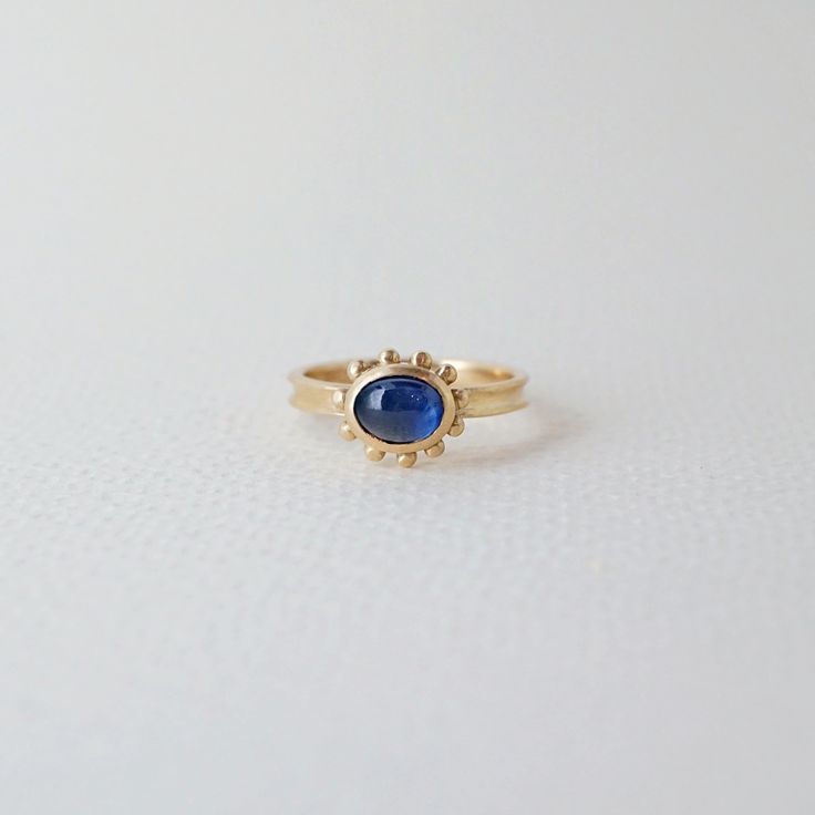 Enchanting beauty of our Nova ring features a striking blue Ceylon sapphire. Hand-carved and delicately designed, this 14k yellow gold ring from our Nova collection will add a touch of dreamy elegance to any outfit. Treat yourself or a loved one to this captivating piece. -hand-carved ring in 14k gold -Ceylon sapphire -signature brushed finish -The ring is made in size 6.5. Resizing available upon request 14k Yellow Gold Sapphire Promise Ring, Blue 14k Gold Sapphire Ring With Rose Cut Diamonds, Yellow Gold Sapphire Diamond Promise Ring, Heirloom Yellow Gold Sapphire Ring With Halo, Heirloom Sapphire Birthstone Promise Ring, 14k Sapphire Promise Ring, 14k Gold Sapphire Ring Stamped 14k, Dainty 14k Yellow Gold Sapphire Ring, Timeless Yellow Gold Sapphire Ring