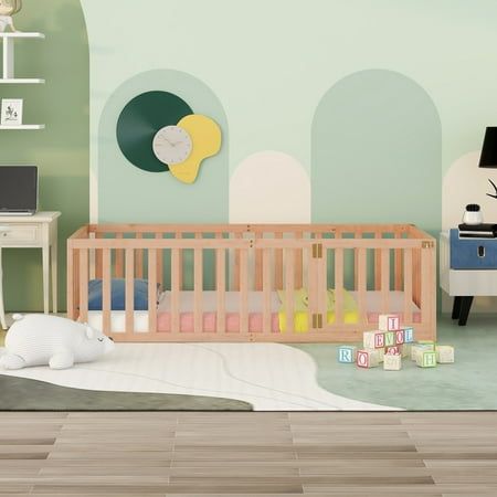 a baby's room with a crib, desk and chair