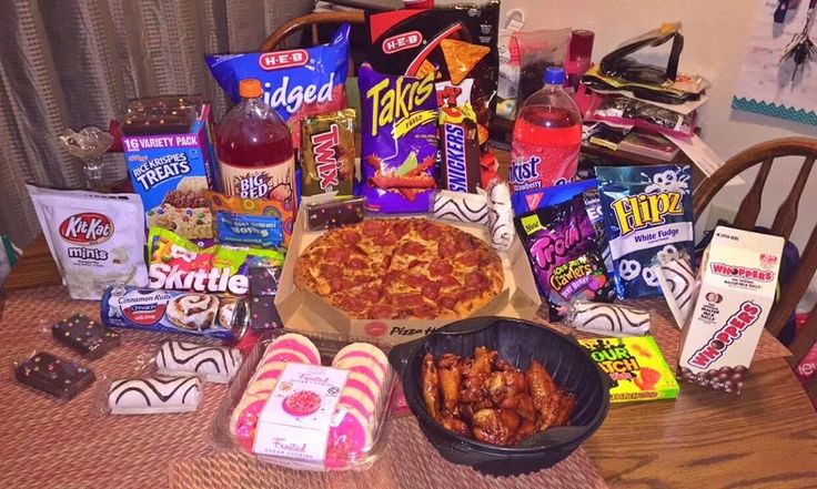 a table topped with lots of food and snacks