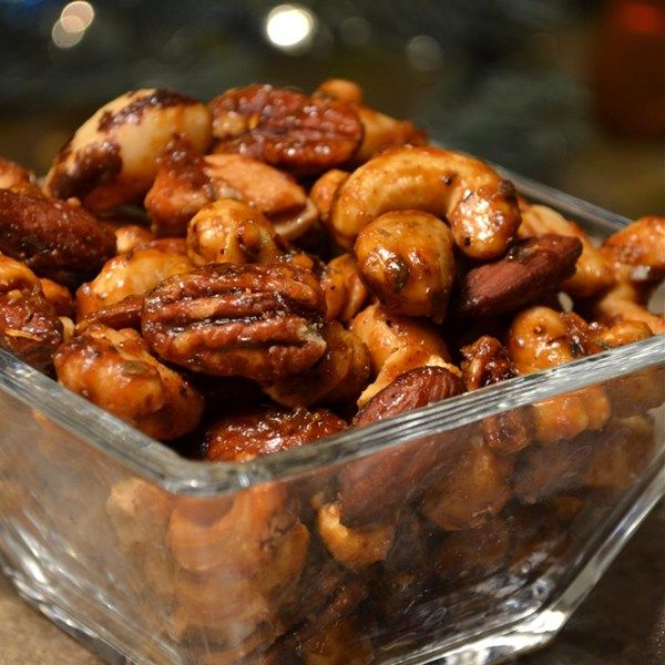 nuts in a plastic container sitting on a table