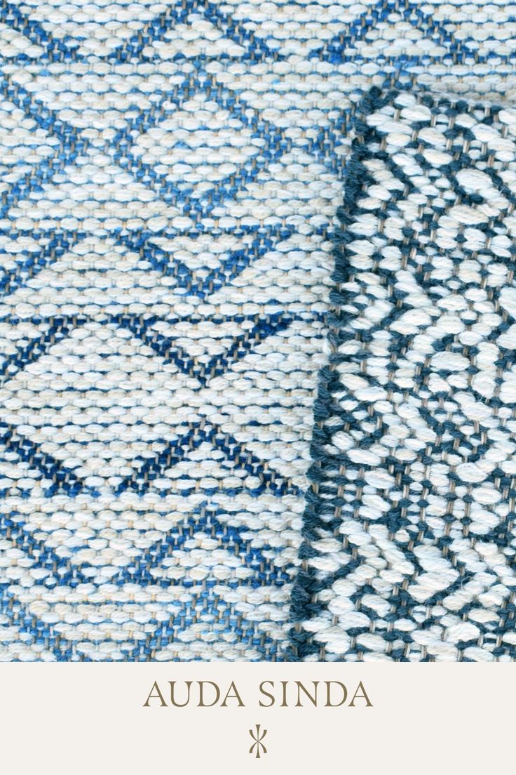 two blue and white rugs with the words auda sinda written on them