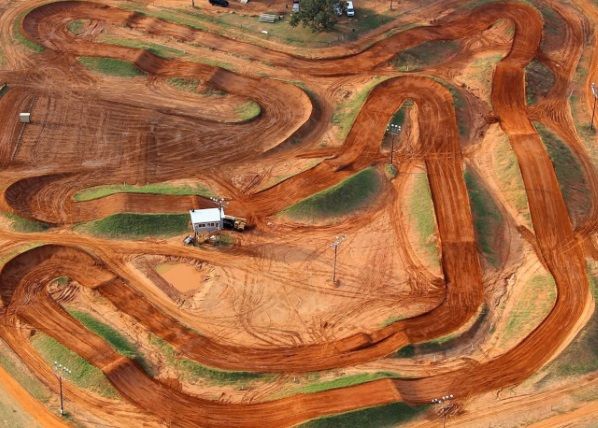 an aerial view of a dirt track in the middle of nowhere