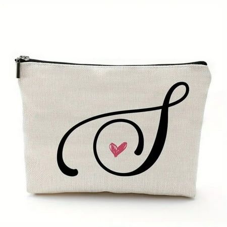 a white zippered pouch with a heart on the front and letter f in black ink