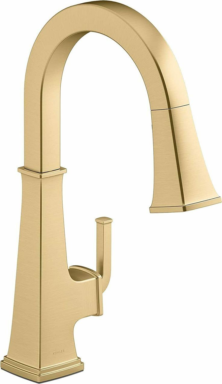 a gold faucet with the handles extended