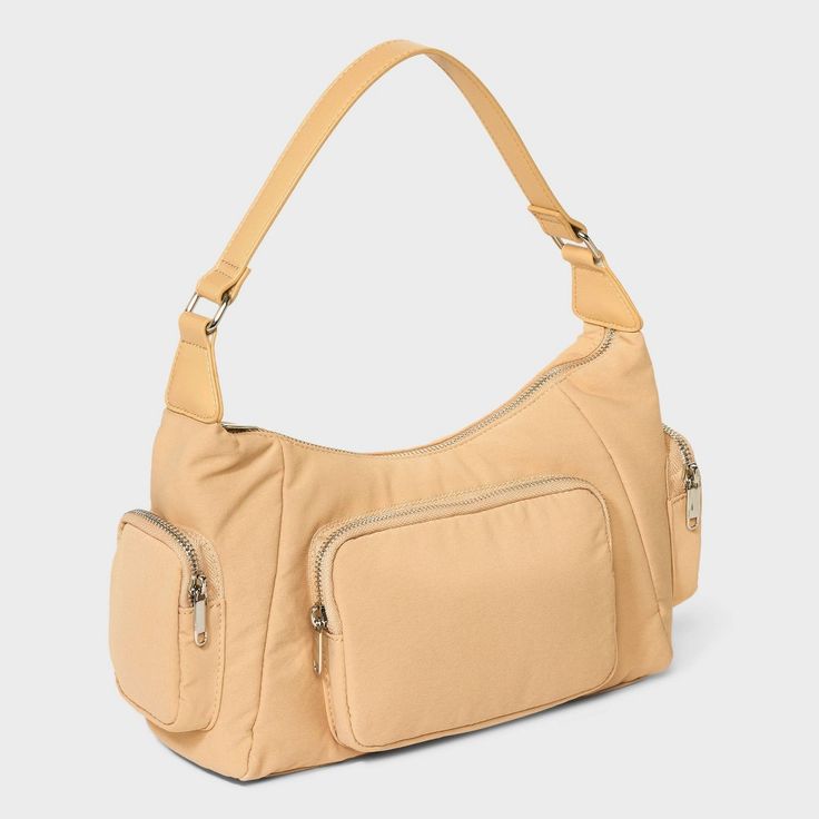 Shoulder handbag from Wild Fable™ boasts a lightweight design. Main compartment with multiple exterior and interior pockets lends ample space for belongings. Adjustable shoulder strap offers convenient carrying. Wild Fable™: A look for every story. If you're not satisfied with any Target Owned Brand item, return it within one year with a receipt for an exchange or a refund. Beige Hobo Bag With Zipper Pocket For Travel, Functional Hobo Shoulder Bag With Zipper Pocket, Functional Hobo Bag With Zipper Pocket, Large Capacity Nylon Hobo Bag For Travel, Travel Shoulder Baguette Bag With Pockets, Large Capacity Nylon Shoulder Bag For Errands, Large Capacity Double Handle Baguette Bag For Travel, Functional Double Handle Shoulder Bag With Zipper, Nylon Satchel Shoulder Bag With Zipper Pocket