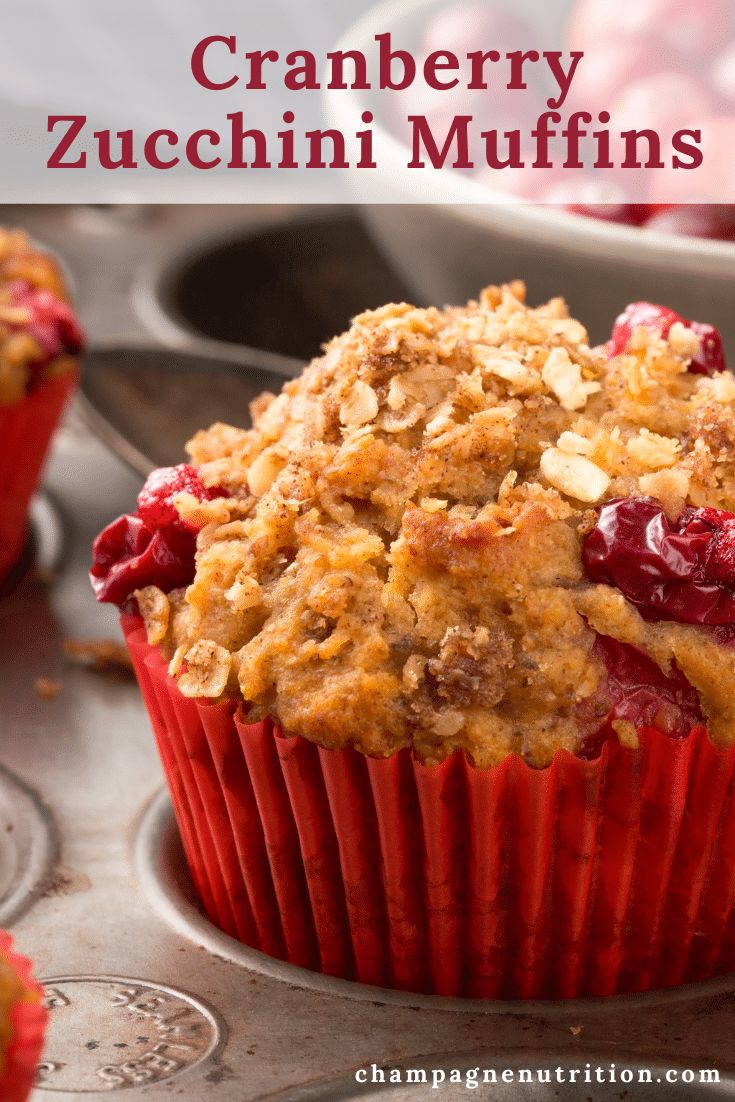 cranberry zucchini muffins in a red cupcake liner