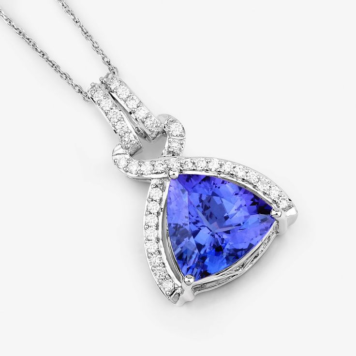 14K White Gold Tanzanite Pendant, Genuine Tanzanite and Diamond Gold Pendant Necklace, Engagement Pendant, Bridal Tanzanite Pendant A luxe look for less! Sparkling with trillion tanzanite gemstone, this crossover pendant necklace will have everyone fooled with its gorgeous gemstone lookalikes. Set in polished 14k white gold with fine finish with a total gemstone weight of 2.53 carats, this pendant necklace exudes a dreamy look. 14k gold tanzanite and diamond pendants are a gorgeous and elegant w Tanzanite Pendant For Anniversary, Tanzanite Pendant Necklace For Anniversary, Tanzanite Gemstone Necklace For Wedding, Anniversary Tanzanite Pendant Jewelry, Anniversary Tanzanite Pendant Necklace, Wedding Tanzanite Pendant Necklace, Fine Jewelry Tanzanite Necklaces For Wedding, White Gold Tanzanite Necklace For Anniversary, Fine Jewelry Tanzanite Necklace