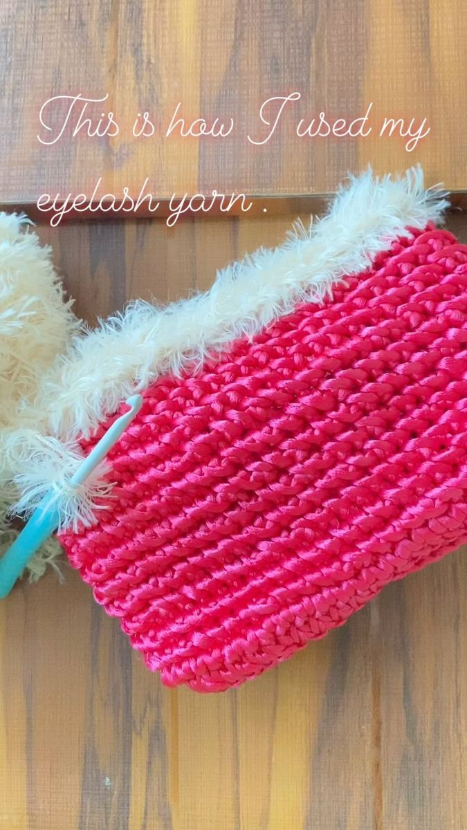 a teddy bear with a knitted pink and white hat on it's head