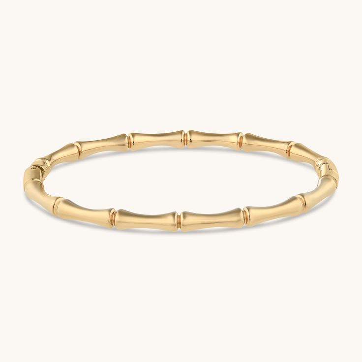 When you’re a nature girl at heart but a city girl by day, our Bamboo Bangle is your new go-to. The sleek gold design effortlessly blends natural elements with street chic. Pair it with our Bamboo Hoops to complete the look. Metal: 18k PVD gold plated over stainless steel Size: Adjustable Hypoallergenic Waterproof Tarnish-free Luxury Tarnish-resistant Bangle For Everyday, Elegant Polished Gold-plated Bangle, Elegant Ceremonial Gold-plated Bangle, Gold-tone Polished Finish Bangle For Gift, Bamboo Bangle, Bamboo Bracelet, Bangle Ring, Waterproof Jewelry, Nature Girl