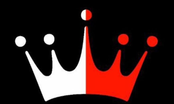 a red and white crown on top of a black background