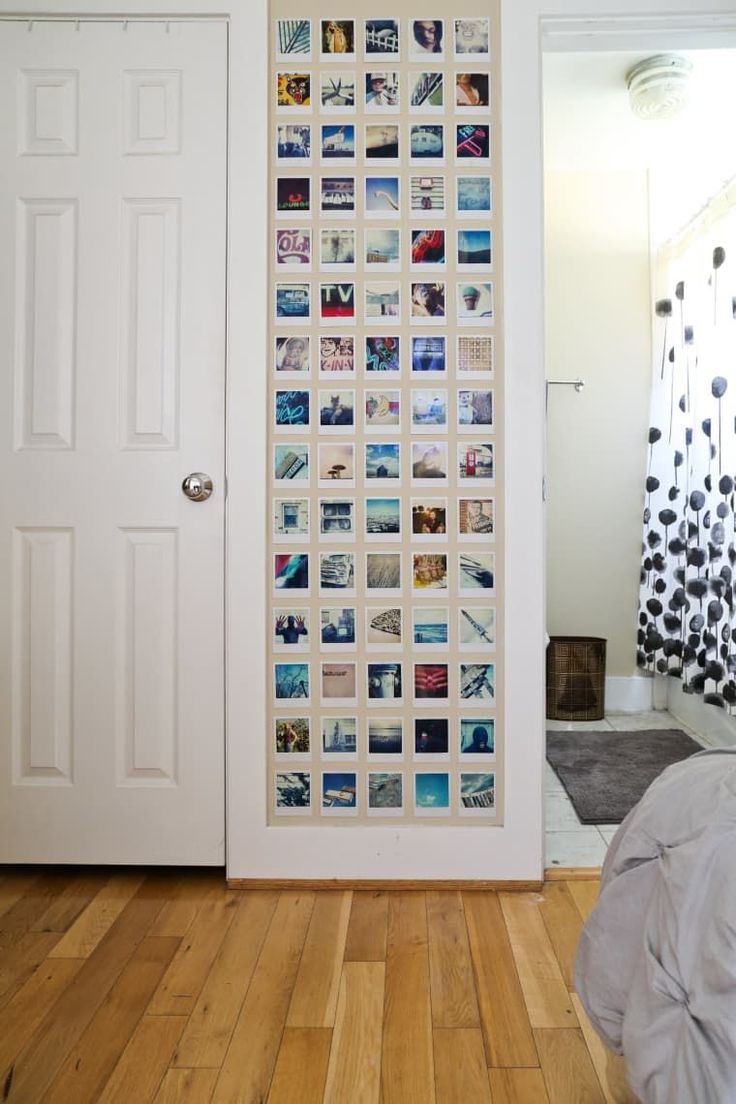 a door with pictures on it and a bed next to it in front of a white door