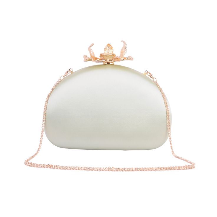 Embrace the epitome of elegance with our Silk Round Clutch, adorned with intricate flower hardware and a chic chain crossbody strap. This sophisticated accessory captures the essence of refined femininity, as the smooth silk exudes luxury and the detailed floral hardware adds a touch of romance. The versatile chain strap ensures effortless carrying, making it an ideal companion for any occasion. Elevate your style and make a statement with this beautifully crafted clutch, where the delicate allure of silk meets the timeless charm of floral design. Elegant Silver Evening Bag With Chain, Elegant Wedding Bags For Spring, Elegant Spring Wedding Bags, Elegant Silver Evening Bag With Detachable Strap, Elegant Evening Bag With Chain, Chain Strap Evening Bag For Events, Luxury Satin Evening Bag For Events, Elegant Formal Bags With Chain Detail, Luxury Bags For Wedding Guests