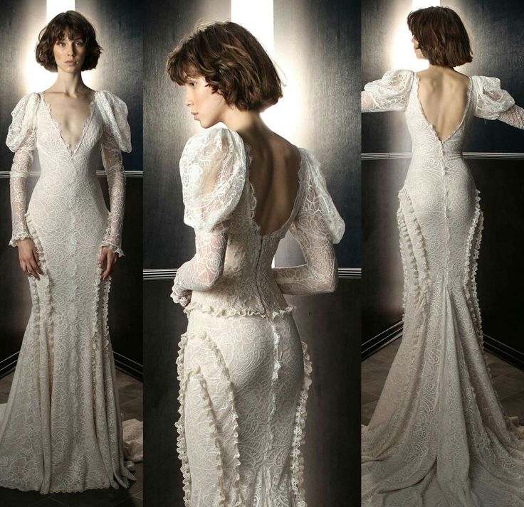 the back of a woman's wedding dress with long sleeves