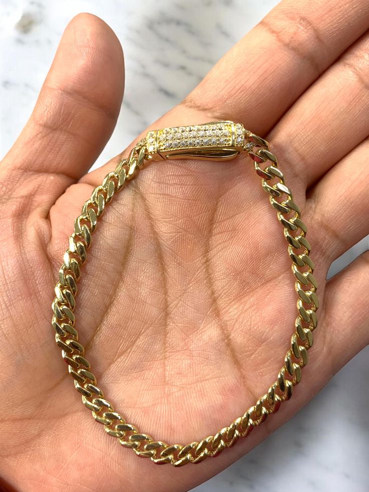 ● 14k Solid Gold Monaco Link Chain With CZ Lock Womens Ladies Bracelet 5mm 14 karat Real Gold 7.5" ●Metal : 14K Yellow Gold ●Purity : 14k with authenticity stamp ●Thickness: 5mm ●Length: 7.5" ●Weight: Approx 7.3 ●Condition : Brand New With Tags ●Clasp : Box CZ Clasp ●Complimentary Premium Jewelry box included ●Free Shipping within U.S.A Be sure to hit "favorite" on the right so it remains on your favorites list and/ or add to your wishlist(s). BUY GENUINE GOLD JEWELRY WITH 100% CONFIDENCE Gold Cuban Link Tennis Bracelet As Gift, Cuban Link Gold Tennis Bracelet Gift, Yellow Gold Diamond Bracelet With Curb Chain, Yellow Gold Cuban Link Tennis Bracelet With Cubic Zirconia, Cuban Link Yellow Gold Tennis Bracelet With Cubic Zirconia, Gold Cuban Link Bracelet With Cubic Zirconia, Yellow Gold Diamond Bracelet With Cuban Link Curb Chain, Gold Diamond Cuban Link Jubilee Bracelet, Gold Diamond Jubilee Bracelet With Cuban Link