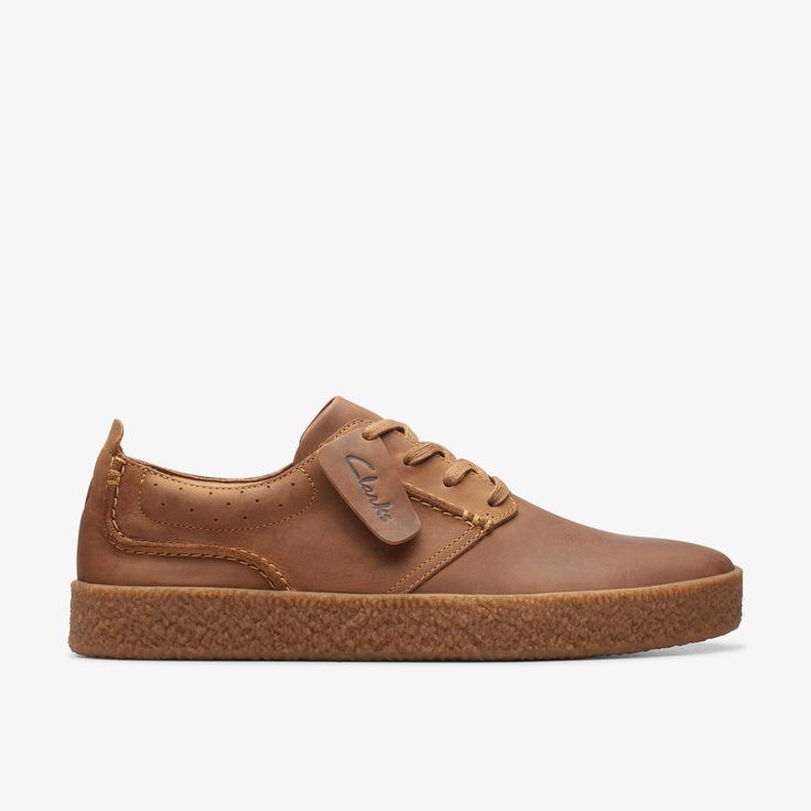 a brown sneaker with a rubber sole