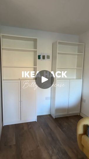 an empty living room with white bookcases and wood flooring on the walls