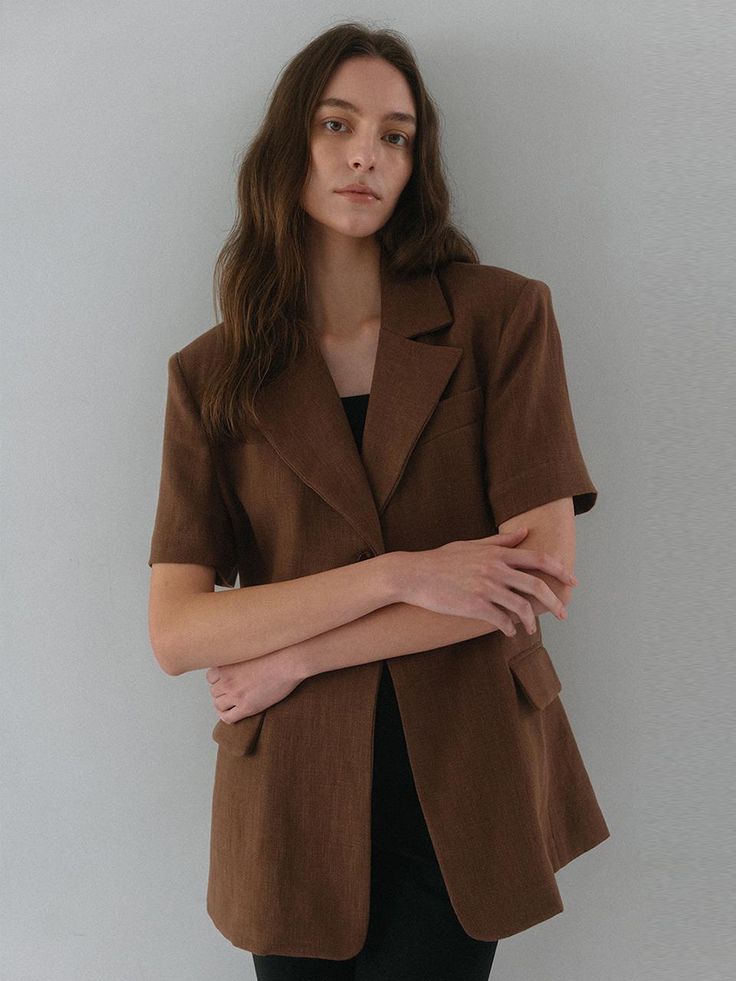 This is a minimal and modern jacket by dankedir that is made out of high quality and sturdy material. With distinctive mood of the design and comfortable wear, you can style it for your clean daily outfit.- Slim waistline and long length- Logo engraved ox horn buttons- Trendy and feminine mood Brown Notch Lapel Blazer For Office, Brown Lapel Collar Outerwear For Work, Brown Outerwear With Lapel Collar For Work, Brown Lapel Collar Blazer For Office, Brown Blazer With Lapel Collar For Office, Brown Blazer With Lapel For Office, Brown Outerwear With Welt Pockets For Office, Brown Office Outerwear With Welt Pockets, Brown Sport Coat With Hidden Button Closure For Office