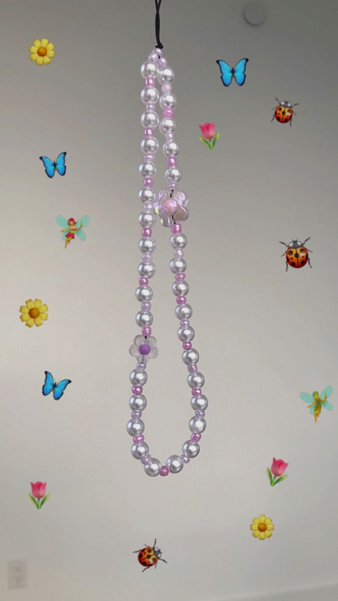 a room with butterflies and beads hanging from the ceiling