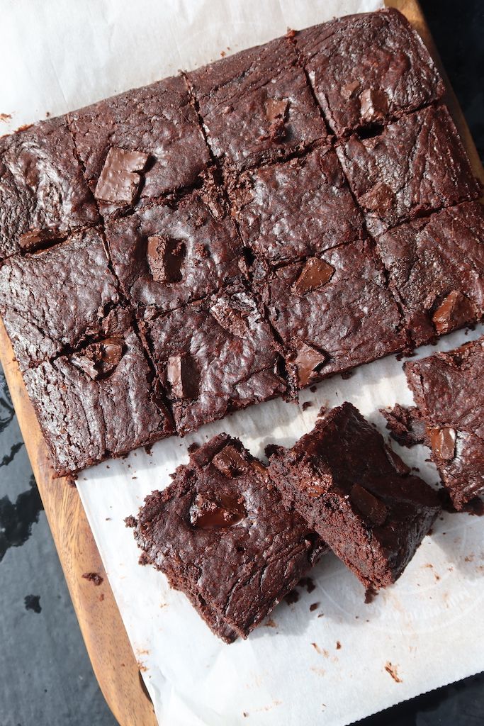 chocolate brownies cut into squares on a cutting board