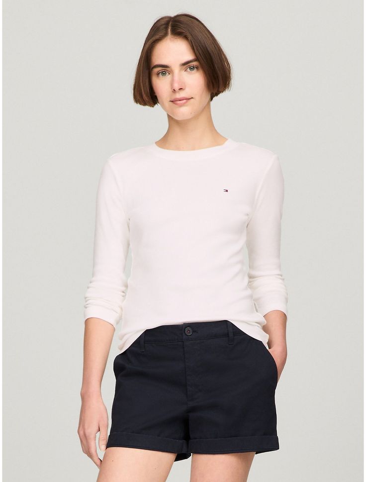 Tommy Hilfiger women's T-shirt. Made from soft, medium weight cotton, our Favorite Tees are designed to fit your form. Another reason to love them? They layer just as easily under a blazer as they do a zip hoodie.  Material: 100% Regenerative Cotton. Classic Tommy Hilfiger Tops For Fall, Tommy Hilfiger Relaxed Fit Tops For Fall, Tommy Hilfiger Crew Neck Tops For Spring, Basic Cotton Tops By Tommy Hilfiger, Casual Everyday Tommy Hilfiger Tops, Tommy Hilfiger Casual Crew Neck Tops, Fitted Tommy Hilfiger T-shirt For Spring, Classic Tommy Hilfiger Relaxed Fit Top, Tommy Hilfiger Spring Crew Neck Tops