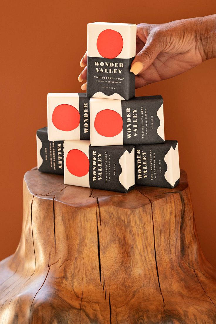 Plant-based soap from the High Desert made with Wonder Valley Olive Oil.  Highly moisturizing with an intoxicating scent of juniper, sage, vetiver, galbanum, eucalyptus, cardamom, and smoke. Naturally pigmented a golden orange with beta carotene, no synthetic fragrances or dyes used. Each bar is stamped with Wonder Valley on the bar. 5oz bar of soap, 2.5 x 3.75 x 1" - one bar of soap per order. Wrapped in 100% PCW recycled paper.  Benefits: Rich Lather • Cleansing without stripping • Microbiome friendly • Moisturizing  Natural Fragrance: Juniper • Sage • Galbanum • Eucalyptus • Cardamom • Vetiver  Featured in GQ's Best Stuff Box 2021  Vegan, cruelty-free. No parabens, phthalates, sls, bht, pegs, artificial dye or fragrance.  Ingredients: Sodium Cocoate, Water, Glycerin, Fragrance (essentia Minimal Soap Packaging, Soap Package Design, Natural Soap Packaging, Soap Branding, Bar Soap Packaging, Packaging Soap, Wonder Valley, Soap Packaging Design, Brand Moodboard