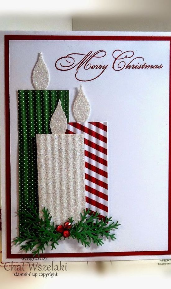 a christmas card with two lit candles