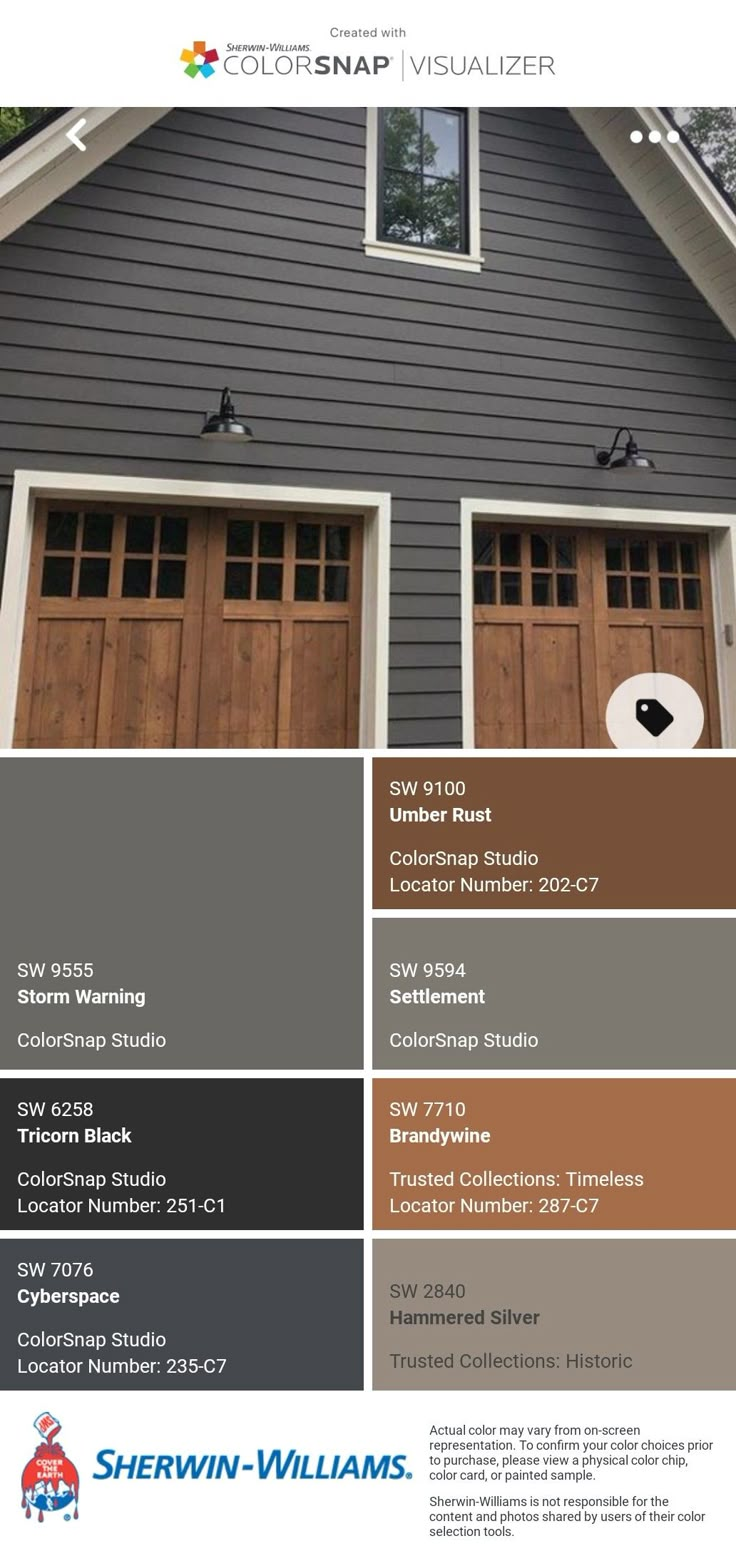 the color scheme for this house is gray and brown, with two garage doors on each side