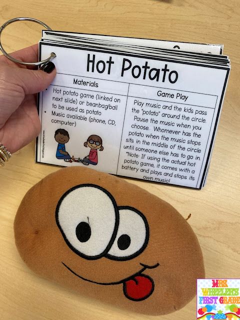 a person holding a hot potato game in their hand next to a clipboard with instructions on it