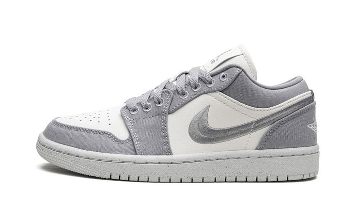 The Women’s Air Jordan 1 Low SE “Light Steel Grey” is a women’s-exclusive colorway of the low-top sneaker with an easy-to-style appearance.  The “Light Steel Grey” Jordan 1 Low SE is complete with a Sail-colored leather base contrasted with Light Steel Grey canvas overlays.  A grey Swoosh is embroidered on the sides of the shoe.  Other classic branding includes a white embroidered “Wings” logo on the heel and a grey Jumpman and grey “Air” logo on the tongue tag.  Release date: April 17, 2023 Air Logo, Grey Jordans, Classic Branding, Sneakers Box, Kobe Shoes, Nike Air Jordan 1 Low, Womens Air Jordans, Jordan 13 Retro, Sporty Sneakers